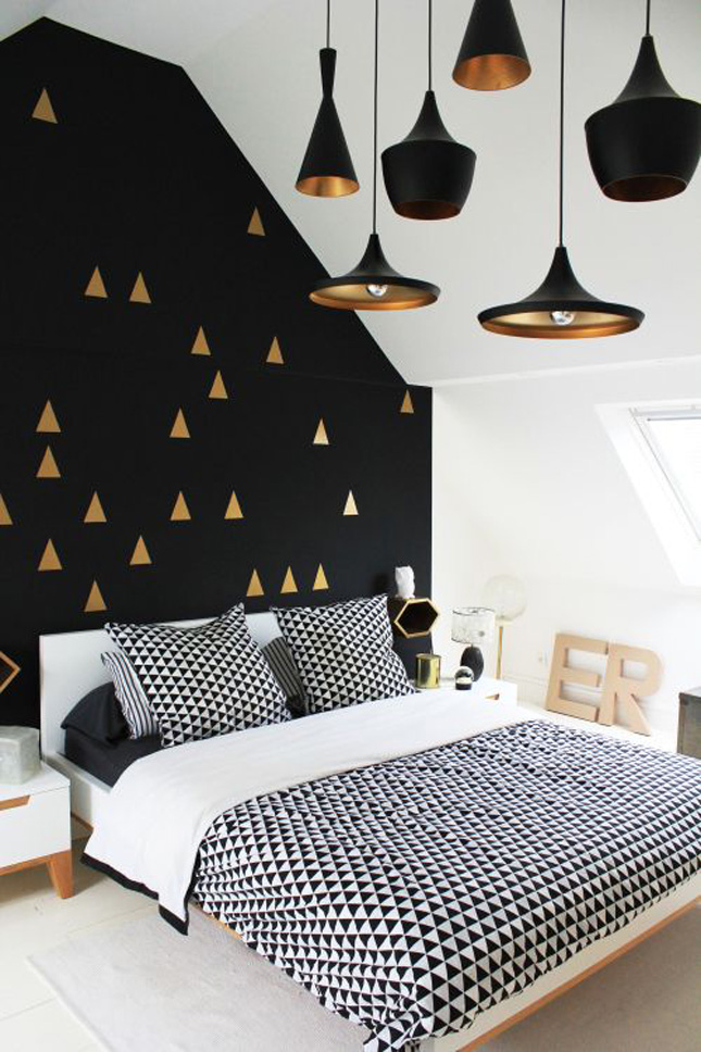 This monochrome colour palette is finished perfectly with gold accents. The geometric patterns team beautifully with the round hanging lights.