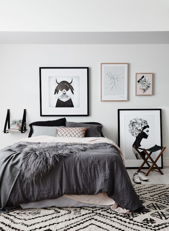 We adore this room's styling. Shades of grey and pink are framed by black for added impact.