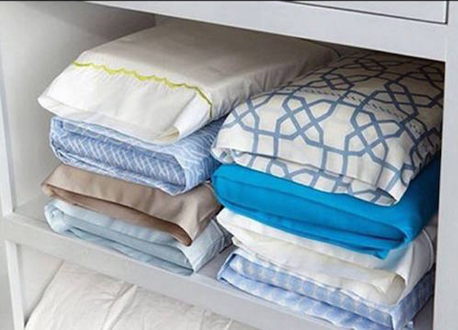 organising bed sheets using pillow cases