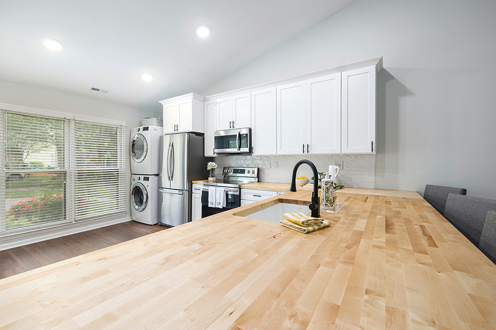 Image of a kitchen with solid wood worktops, available from Noyeks Newmans