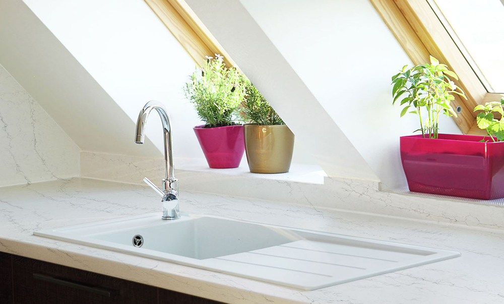 Image of a kitchen with quartz worktops, available from Noyeks Newmans