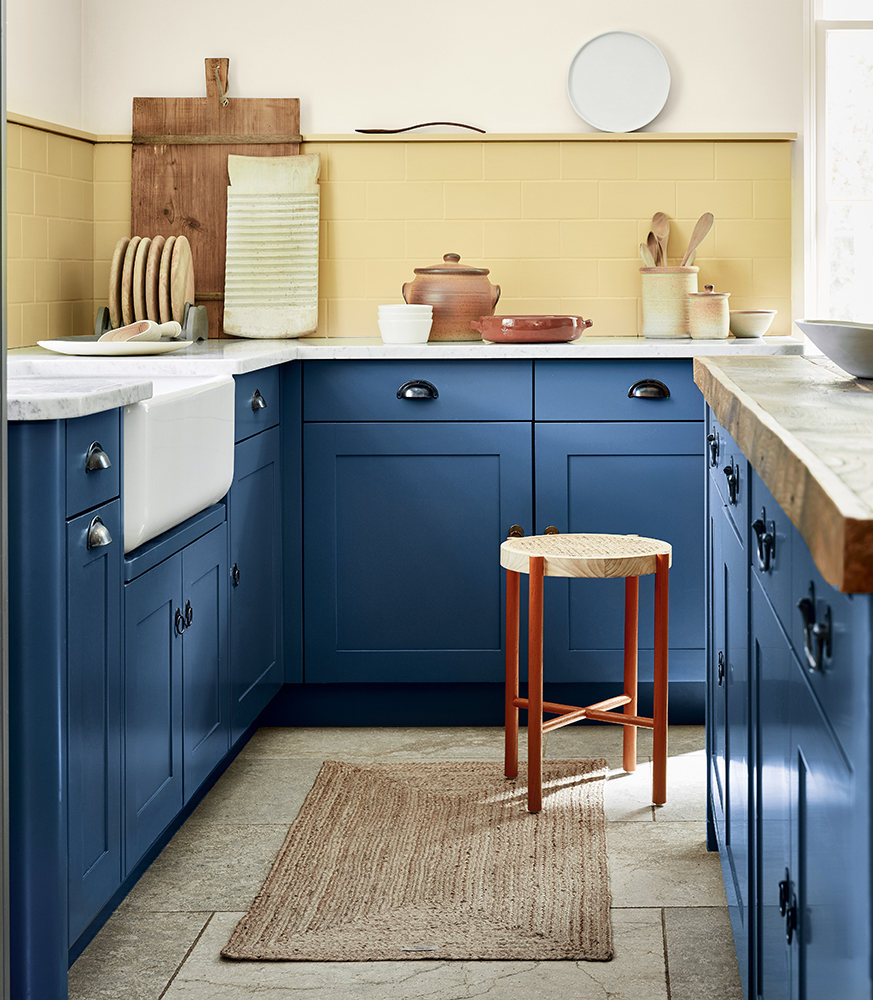 Image of blue kitchen and yellow splashback, colours by Little Greene