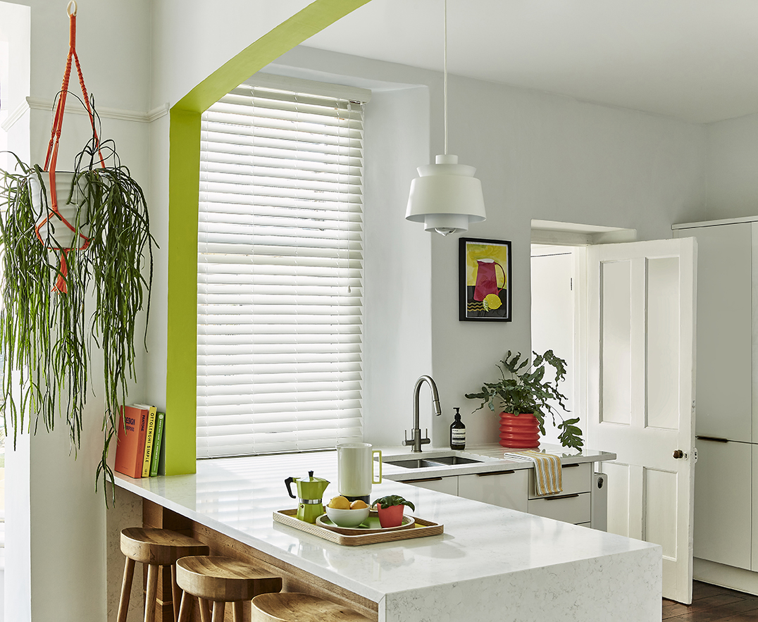 Image of Hillarys Mirage White Maple Faux Wood blind in a kitchen