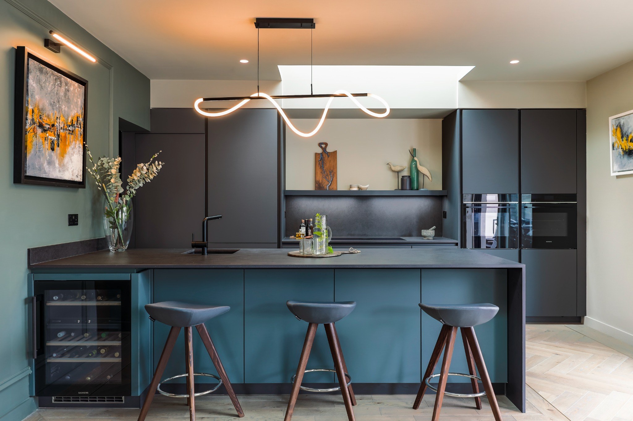 Contemporary McNally Living kitchen with modern cabinetry and integrated appliances.
