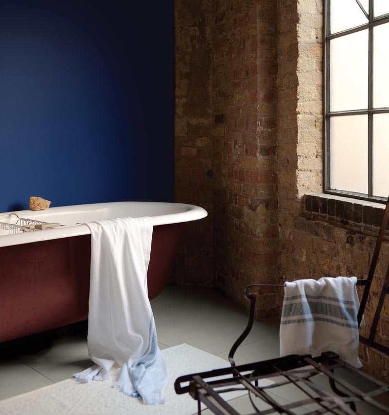 industrial bathroom with exposed redbrick